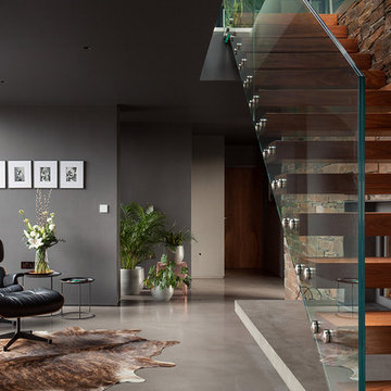 Contemporary staircase: walnut, glass, concrete