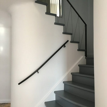 Contemporary vertical angled steel cable railing