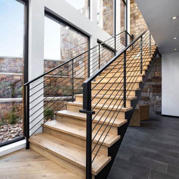 Modern Wooden Staircase with Metal Handrail