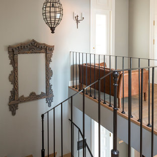 Design ideas for a medium sized mediterranean wood metal railing staircase in London.