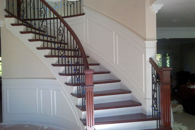 Example of an arts and crafts staircase design in Orange County
