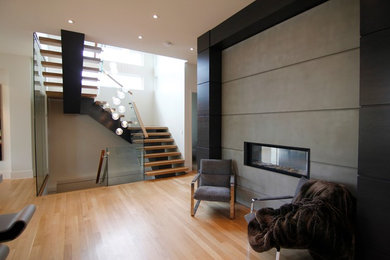 Staircase - mid-sized modern wooden u-shaped open staircase idea in Calgary
