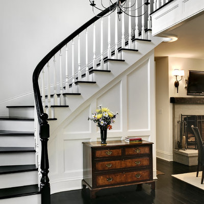Staircase - traditional wooden curved staircase idea in New York