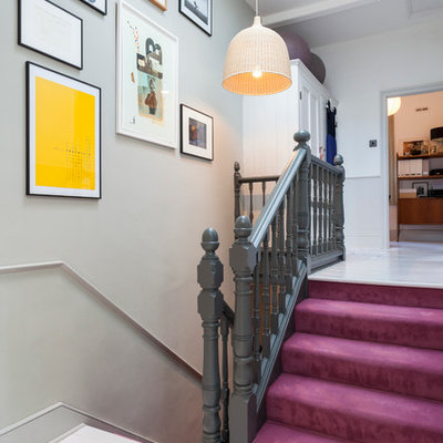 Inspiration for a scandinavian carpeted u-shaped staircase remodel in London with carpeted risers
