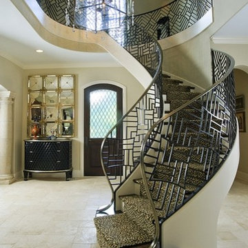 Curved Floating Staircase with Custom Iron and Bronze Railing