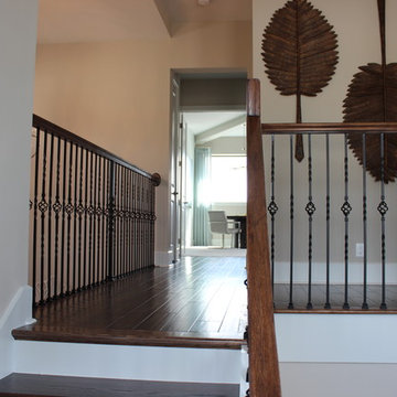 Curved Red Oak Stair with Single Basket & Twist Iron Balusters