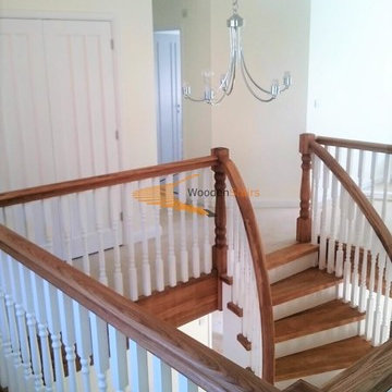 Curved solid Oak and painted Birch staircase with curved under-stair storage