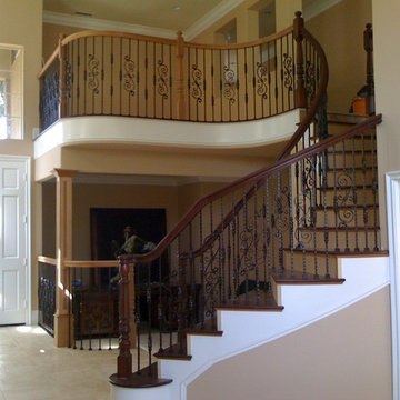 Curved Staircase with Enkeboll post, and recessed panel column