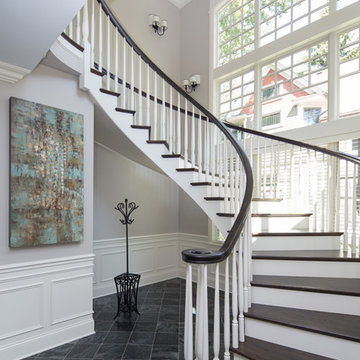 Custom Built Curving Two Tone Wood Staircase