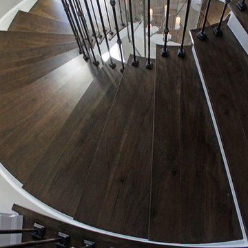 Custom Circular 3-Story Walnut Stair With Iron BalustersS