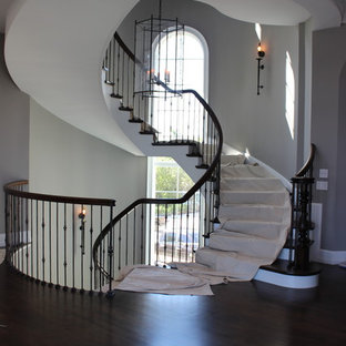 Custom Circular 3-Story Walnut Stair With Iron BalustersS