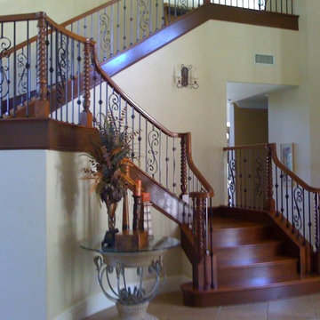 Custom Curved Maple Staircase with Iron Balusters