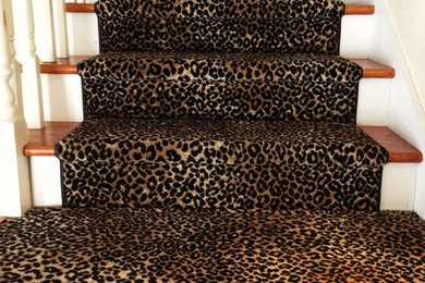 Staircase - modern carpeted staircase idea in Chicago with carpeted risers