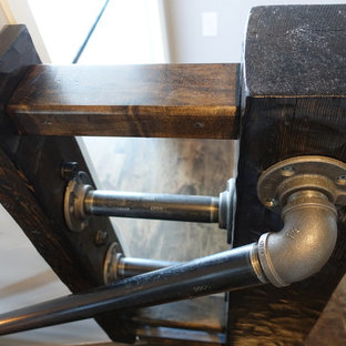 Large arts and crafts wooden straight staircase photo in Denver with wooden risers