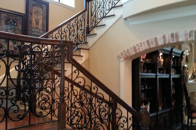 Large arts and crafts painted u-shaped staircase photo in Austin with painted risers