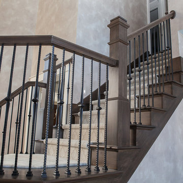 Custom staircase with wrought iron balusters