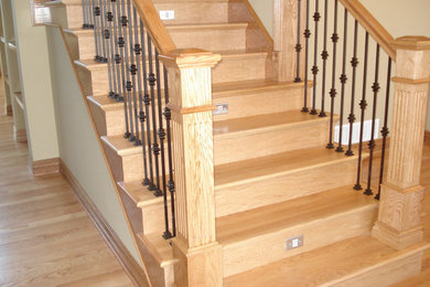 Inspiration for a wood staircase in Omaha with wood risers.