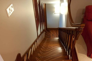 Imagen de escalera en L de tamaño medio con escalones de madera y contrahuellas de madera