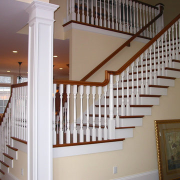 Custom Sweeping Staircase with Wood Spindles