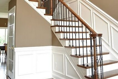 Example of a classic wooden l-shaped staircase design in New York with painted risers