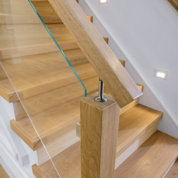Custom White Oak Staircase with Starfire Tempered Glass Panels