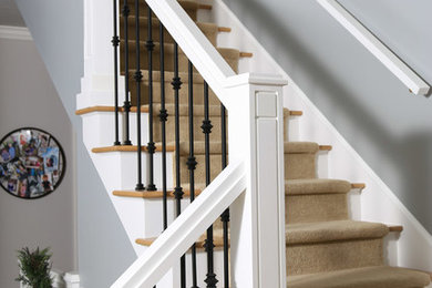 Example of an arts and crafts wooden staircase design in Indianapolis