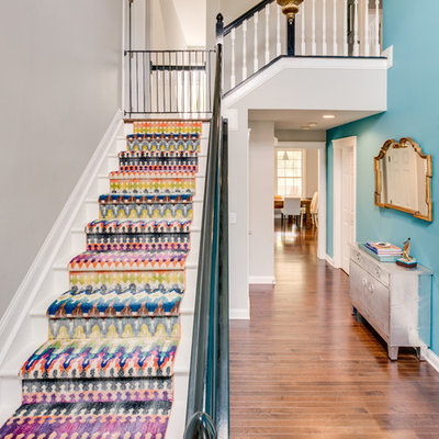 Example of a mid-sized transitional painted l-shaped staircase design in Columbus with painted risers