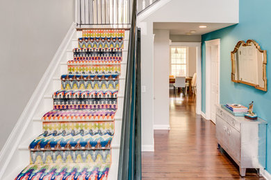 Example of a mid-sized transitional painted l-shaped staircase design in Columbus with painted risers