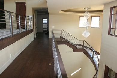 Inspiration for a modern carpeted curved staircase remodel in Las Vegas with carpeted risers