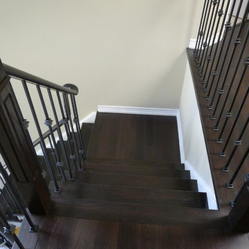 Dark hardwood stairs white risers - Burlington Ontario - custom matched staining