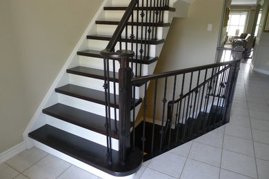 Dark hardwood stairs white risers - Burlington Ontario
