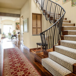 Staircase - mediterranean wooden staircase idea in Dallas with wooden risers