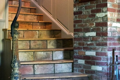 Inspiration for a medium sized rustic wood curved staircase in Bridgeport with tiled risers.