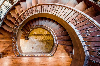 Example of a huge classic carpeted floating staircase design in Salt Lake City with wooden risers