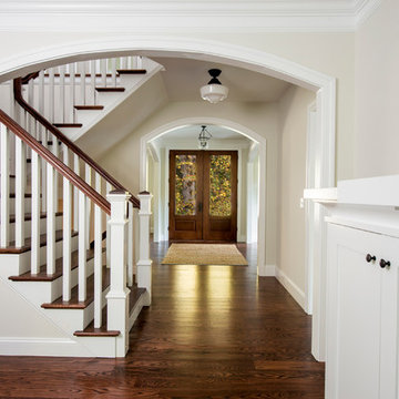 Double Door Entry with Wood Rail Staircase