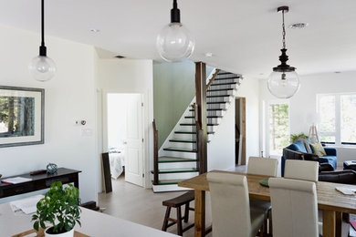 Example of a mid-sized trendy wooden l-shaped wood railing staircase design in Other with painted risers