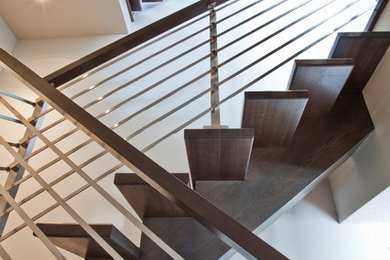 Inspiration for a modern wooden straight open staircase remodel in Calgary