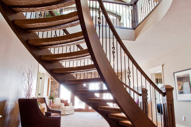 Staircase - traditional carpeted curved open staircase idea in Calgary