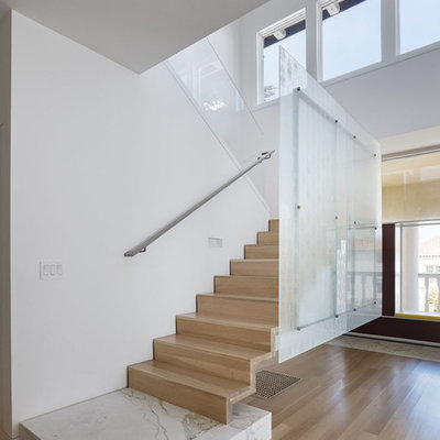 Example of a minimalist wooden staircase design in San Francisco with wooden risers