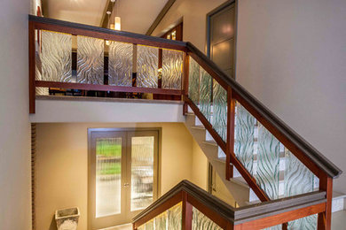 Inspiration for a mid-sized contemporary concrete u-shaped staircase remodel in Seattle with tile risers