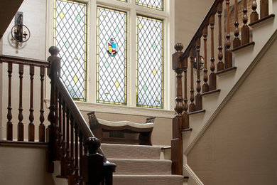 Mid-sized elegant wooden u-shaped staircase photo in New York with painted risers