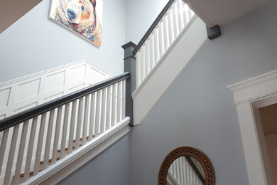 Staircase - large craftsman u-shaped wood railing staircase idea in Montreal