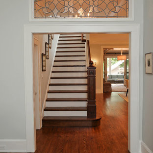 Example of a mid-sized classic wooden straight staircase design in Charlotte with painted risers