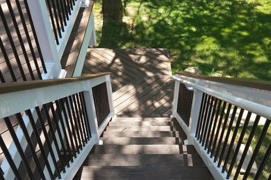 Ejemplo de escalera recta moderna grande con escalones de madera