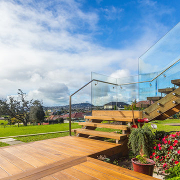 External stairs linking the outdoor decks on both levels and into the garden.