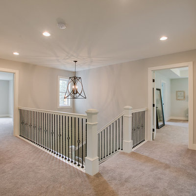Inspiration for a farmhouse wooden u-shaped staircase remodel with painted risers