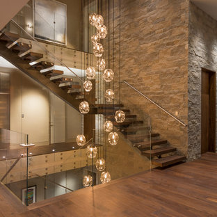 Inspiration for a contemporary wooden l-shaped open and glass railing staircase remodel in Orange County