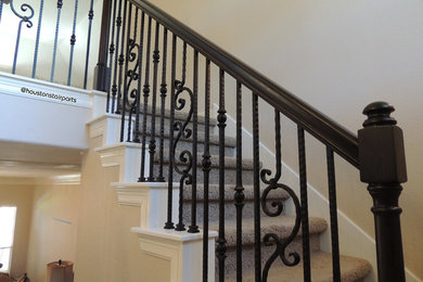 Staircase - mid-sized transitional carpeted l-shaped staircase idea in Houston with carpeted risers
