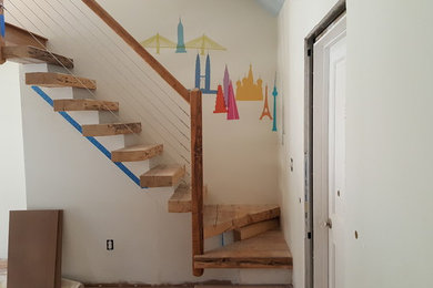 Inspiration for a country wooden floating staircase remodel in Boston