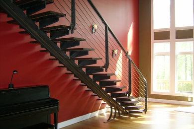 Inspiration for a modern wooden floating open staircase remodel in Philadelphia